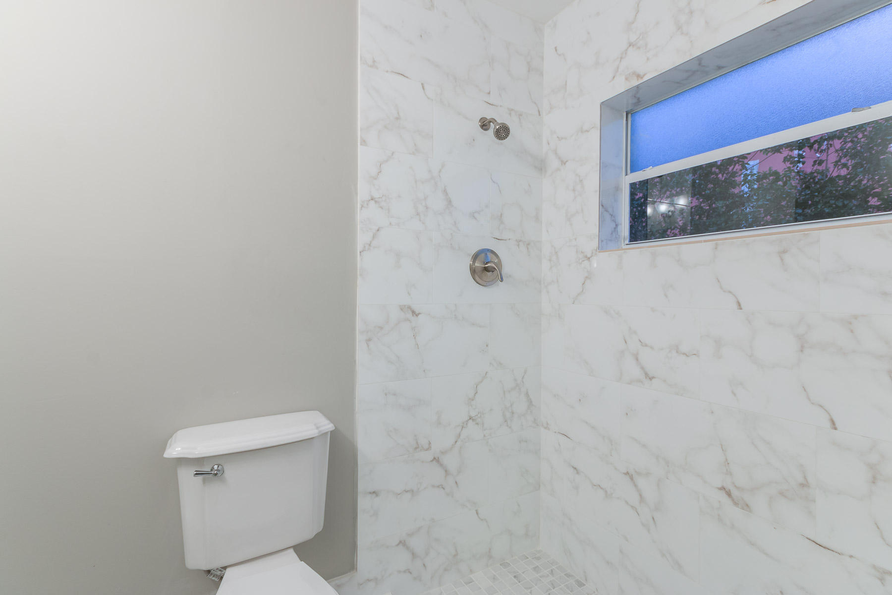 9222 Southwest 1st Place Boca Raton, FL 33428 - Photo 14 of 23 a bathroom with a toilet and a shower