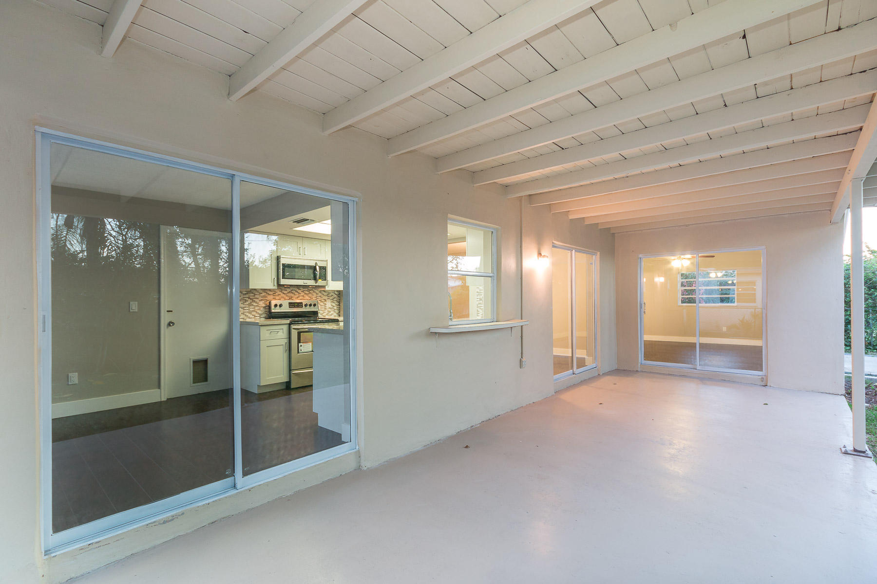 9222 Southwest 1st Place Boca Raton, FL 33428 - Photo 20 of 23 a view of a hallway with wooden floor