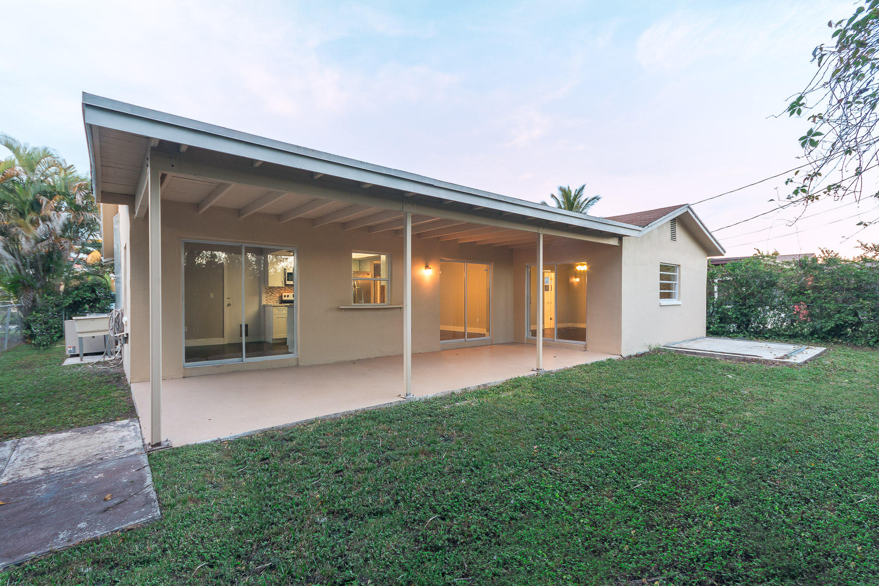 9222 Southwest 1st Place Boca Raton, FL 33428 - Photo 22 of 23 a view of a house with backyard and porch