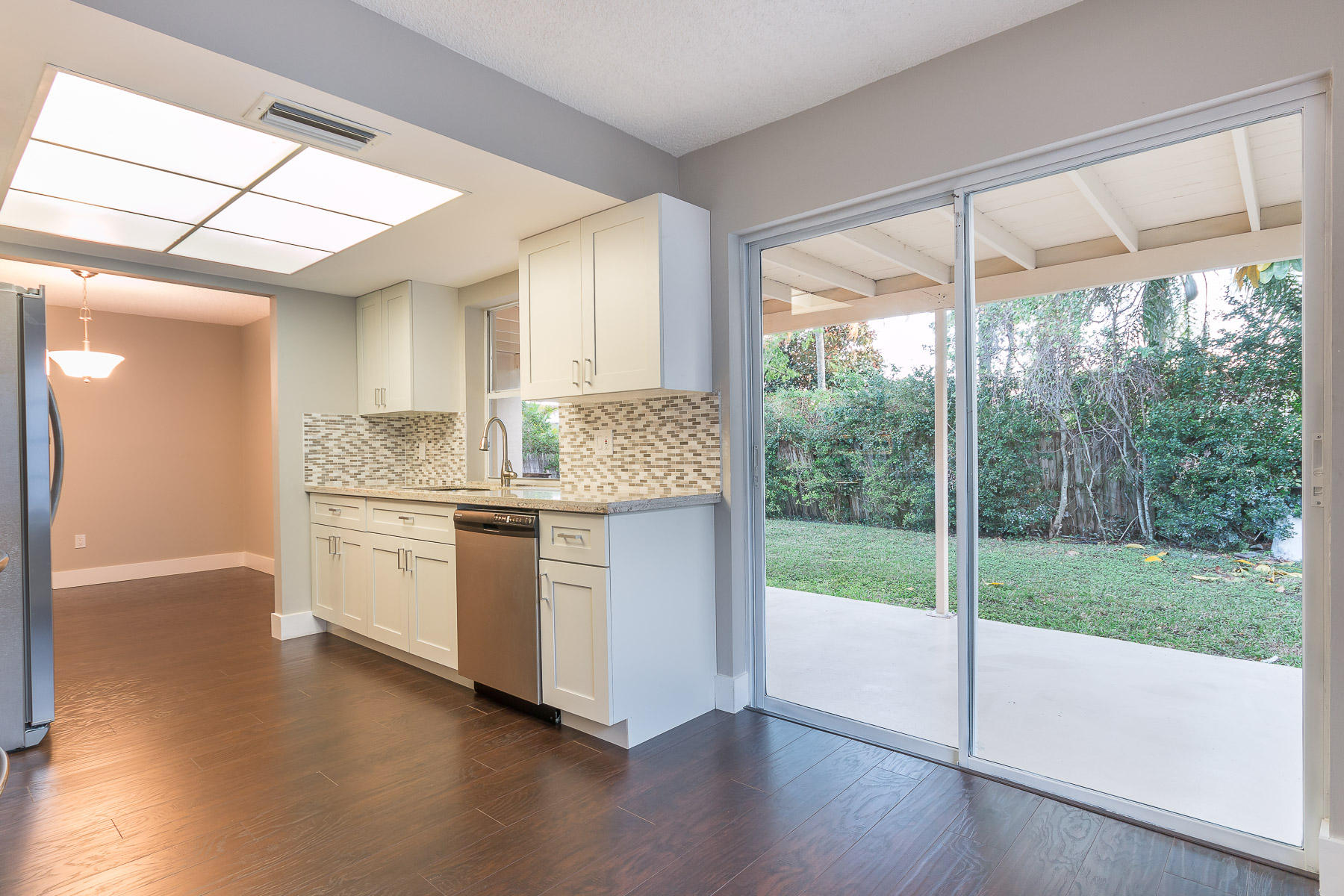 9222 Southwest 1st Place Boca Raton, FL 33428 - Photo 4 of 23 a kitchen with a sink and wide window