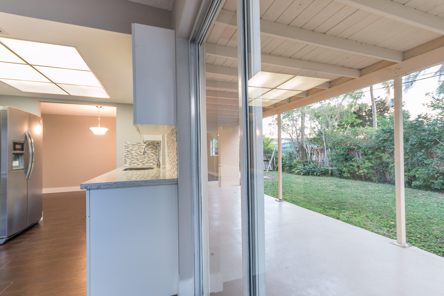 9222 Southwest 1st Place Boca Raton, FL 33428 - Photo 6 of 23 a view of a room with window and wooden floor