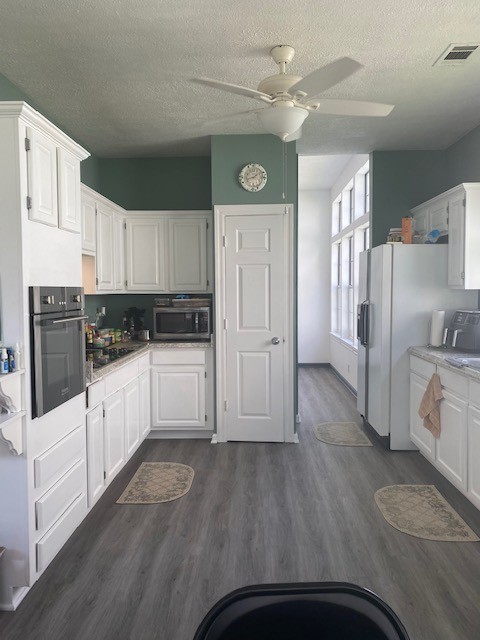 4740 Billingsgate Road Antioch, TN 37013 - Photo 12 of 18 a kitchen with white cabinets and white appliances