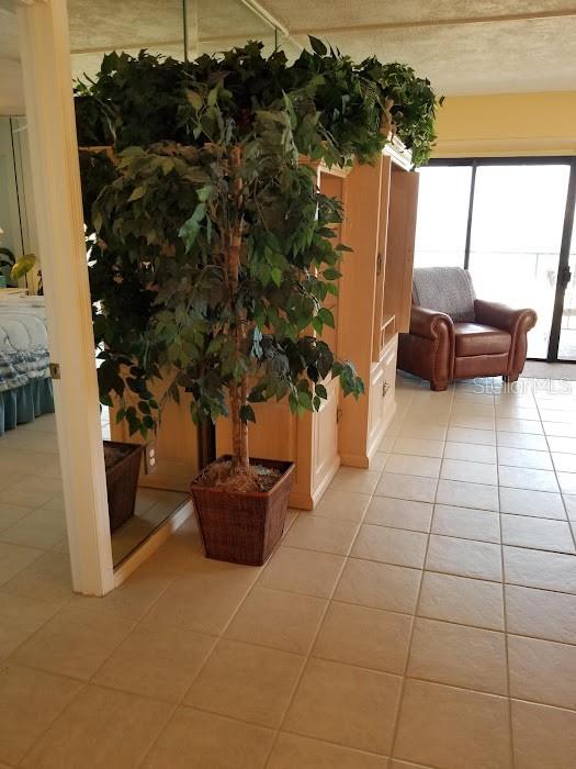 13650 Gulf Boulevard, Unit 304 Madeira Beach, FL 33708 - Photo 33 of 63 a view of a terrace with furniture and rug