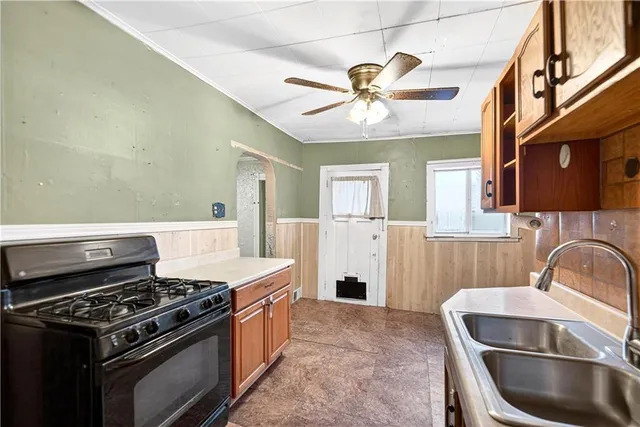 a kitchen with a stove and a sink