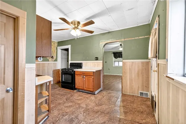 a kitchen with a refrigerator and a sink