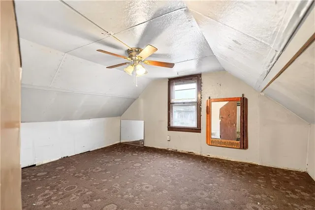 a view of a ceiling fan with a ceiling fan
