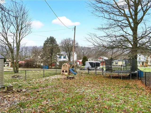 a view of a deck with couches and wooden floor