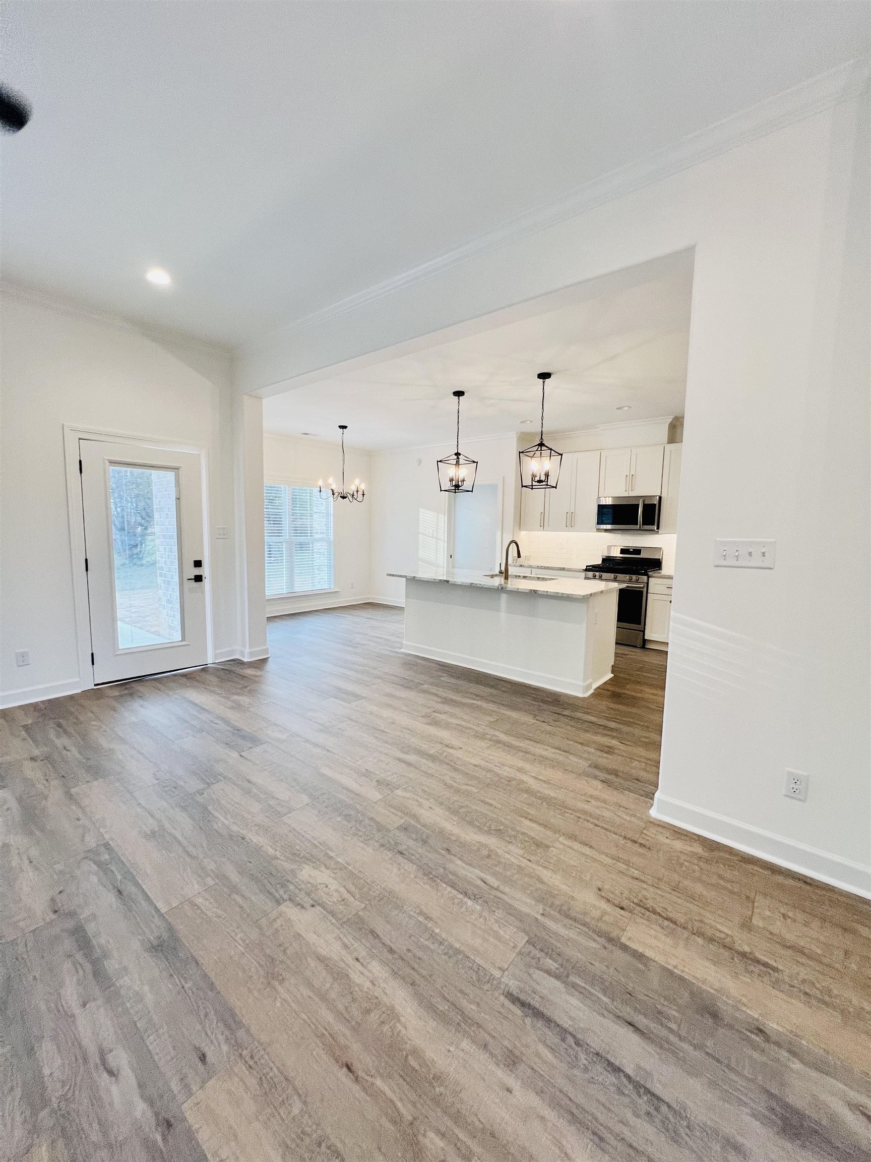 17 Edith Lane Atoka, TN 38004 - Photo 14 of 36 a view of a kitchen with wooden floor and a sink