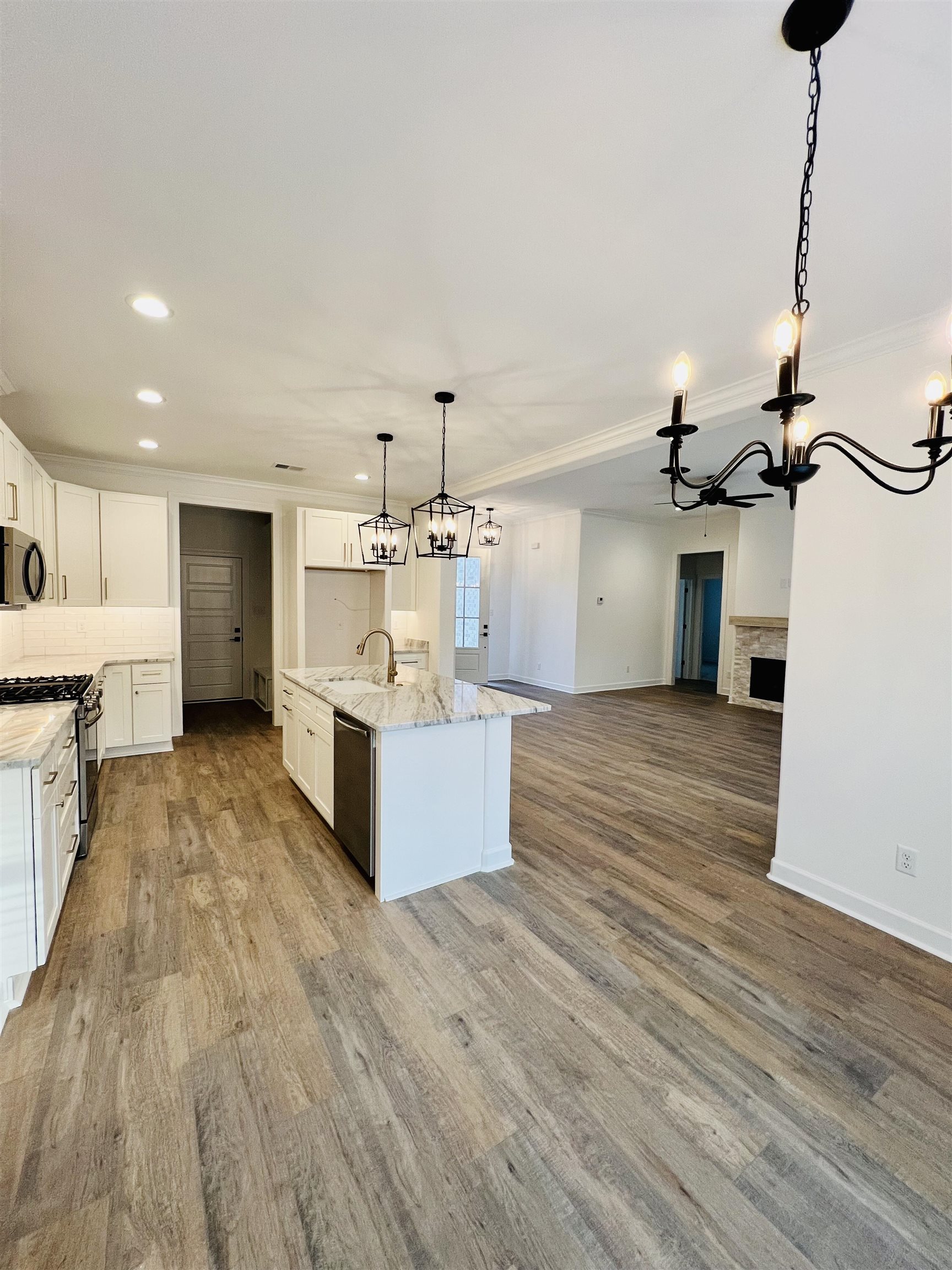 17 Edith Lane Atoka, TN 38004 - Photo 17 of 36 a large kitchen with stainless steel appliances kitchen island a large counter top a sink and a stove