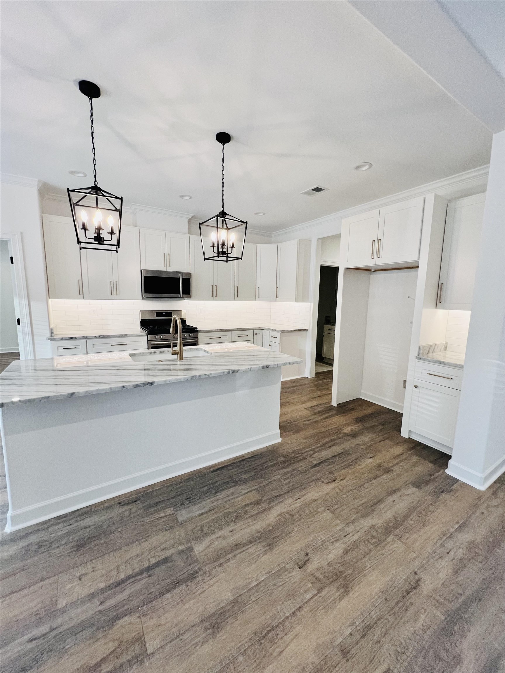 17 Edith Lane Atoka, TN 38004 - Photo 18 of 36 a view of kitchen with granite countertop cabinets and refrigerator