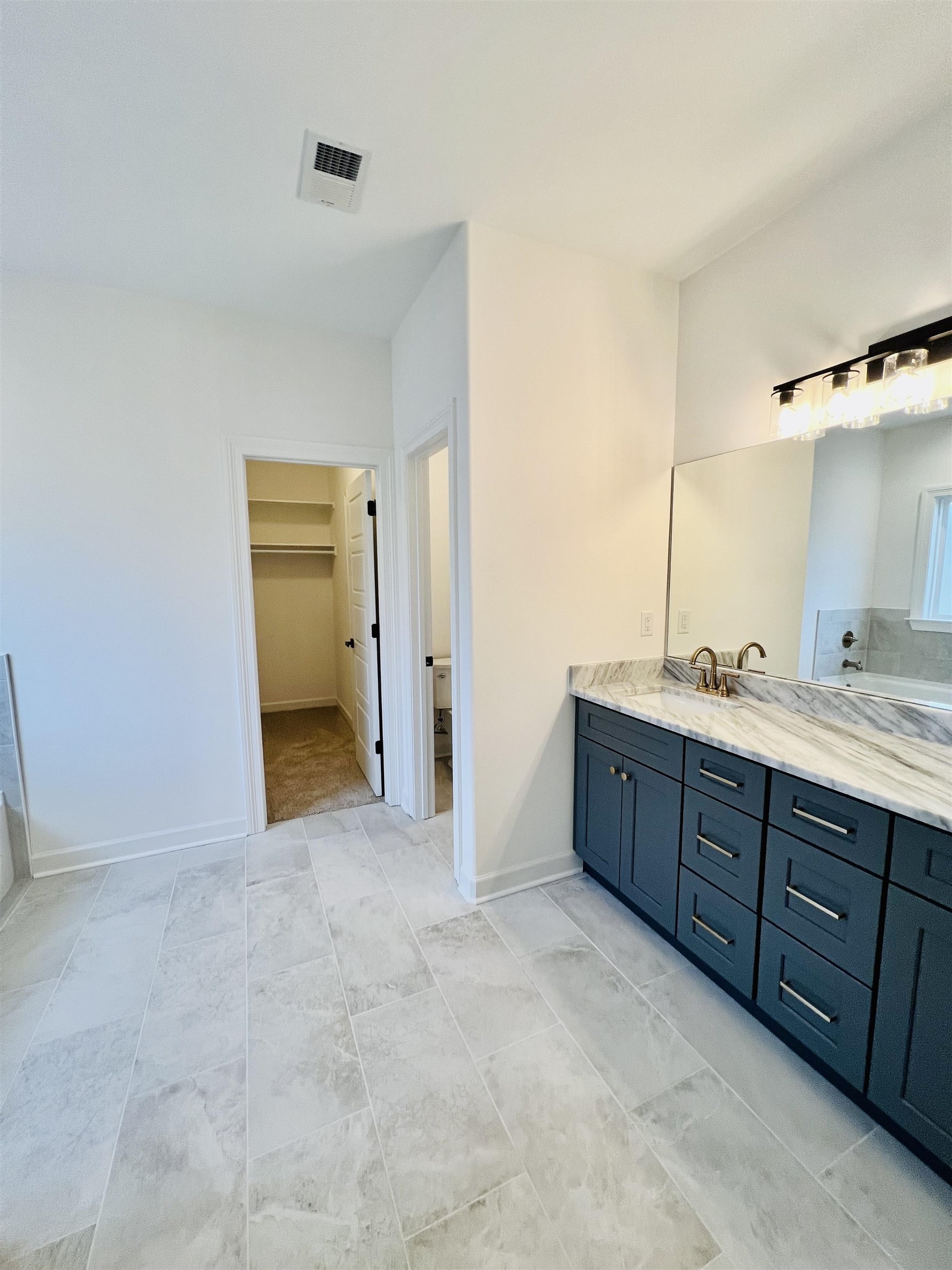 17 Edith Lane Atoka, TN 38004 - Photo 22 of 36 a bathroom with a granite countertop sink and mirror
