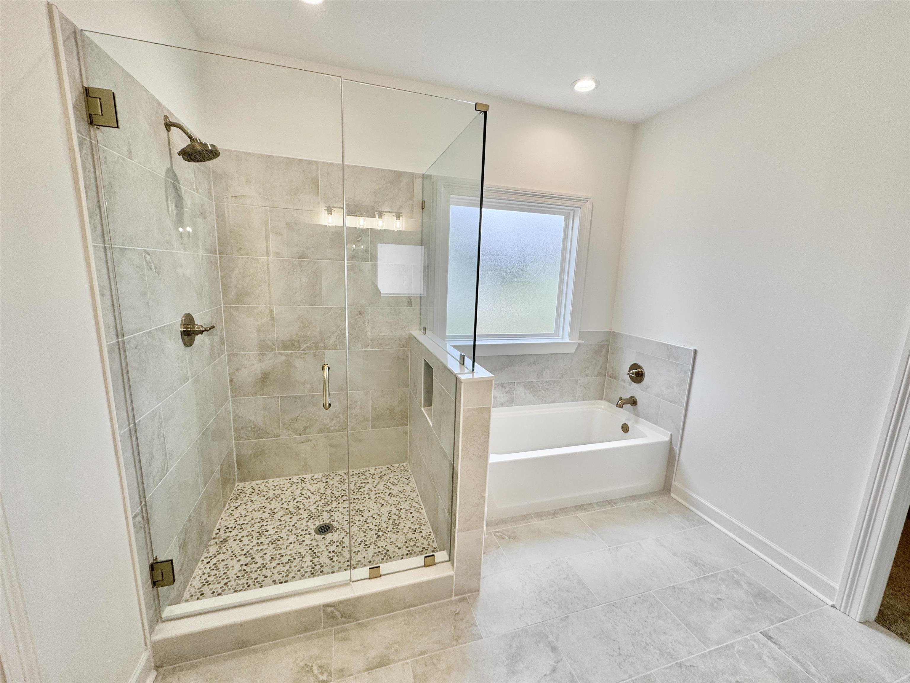 17 Edith Lane Atoka, TN 38004 - Photo 24 of 36 a bathroom with a bathtub and a shower