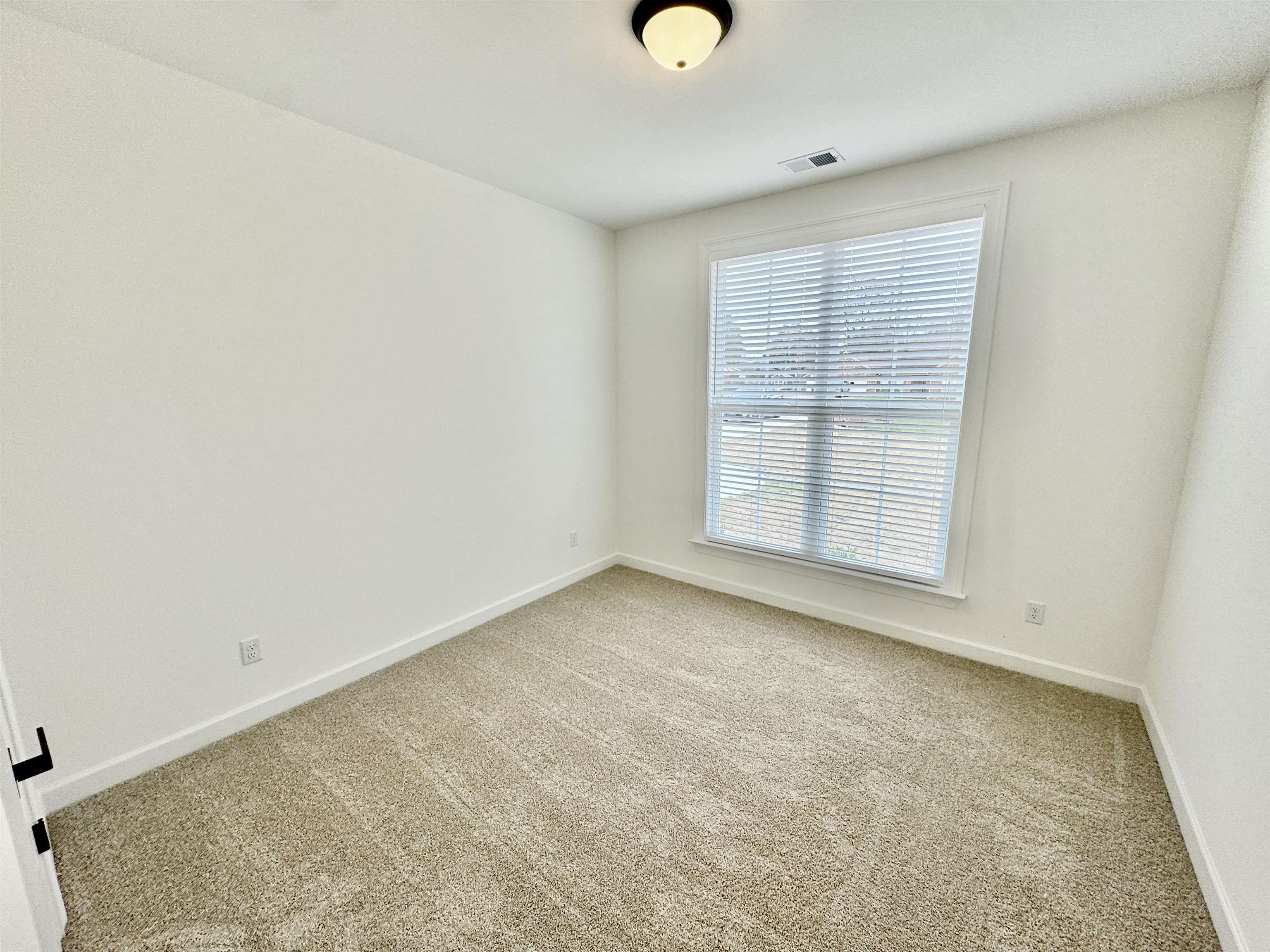 17 Edith Lane Atoka, TN 38004 - Photo 28 of 36 an empty room with windows & cabinet