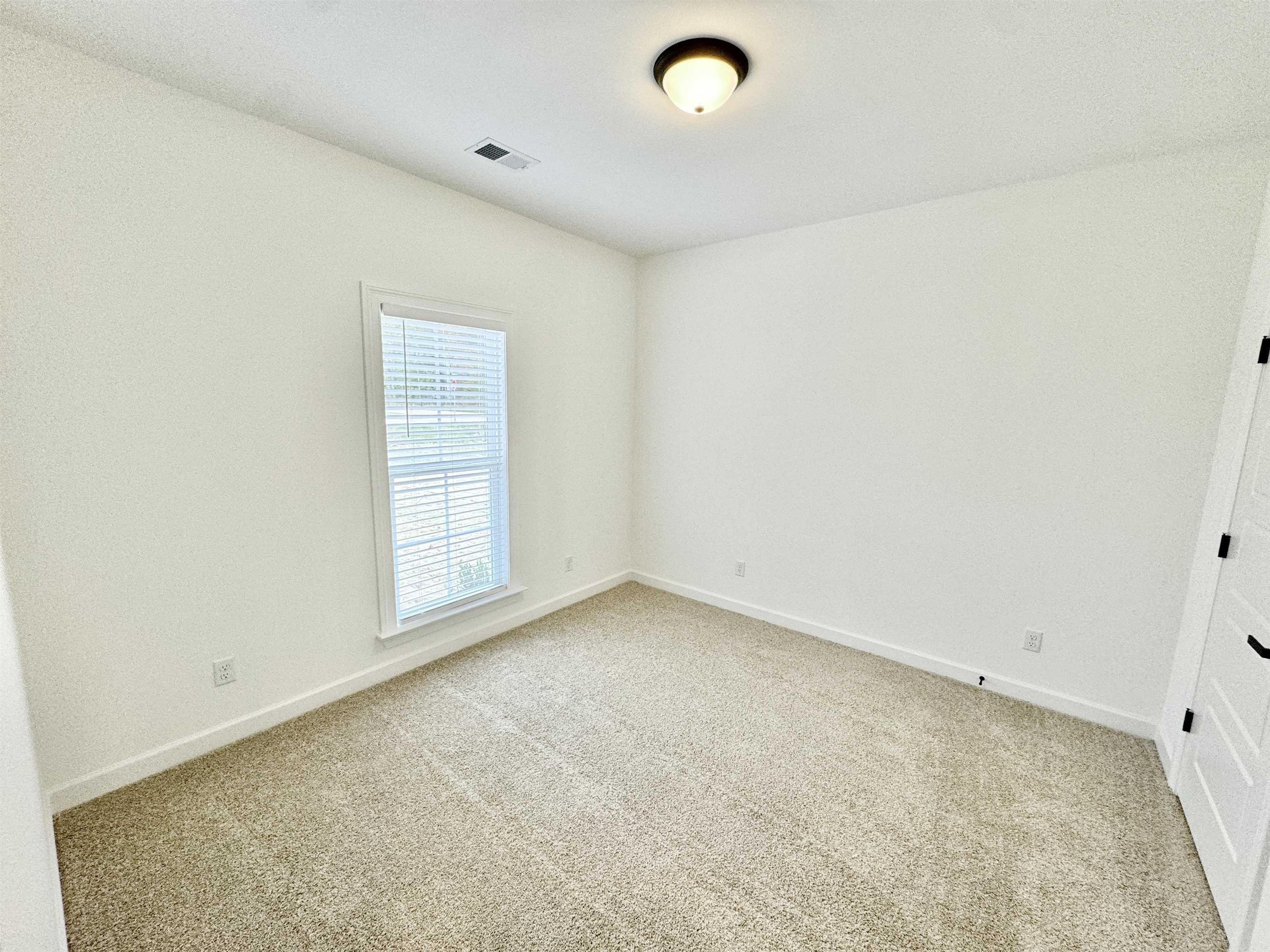 17 Edith Lane Atoka, TN 38004 - Photo 29 of 36 an empty room with a empty space and window