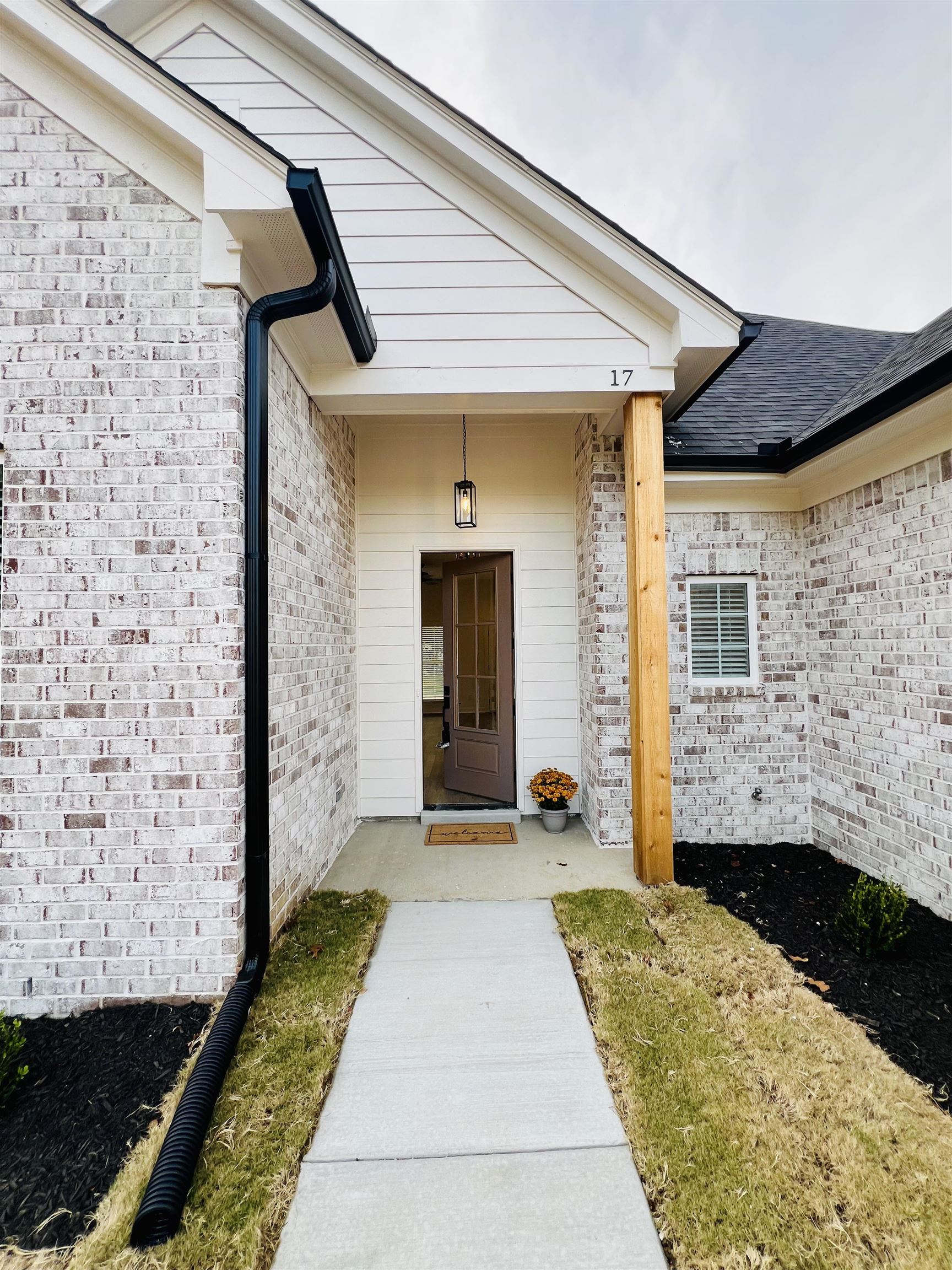 17 Edith Lane Atoka, TN 38004 - Photo 3 of 36 a front view of a house with a garden