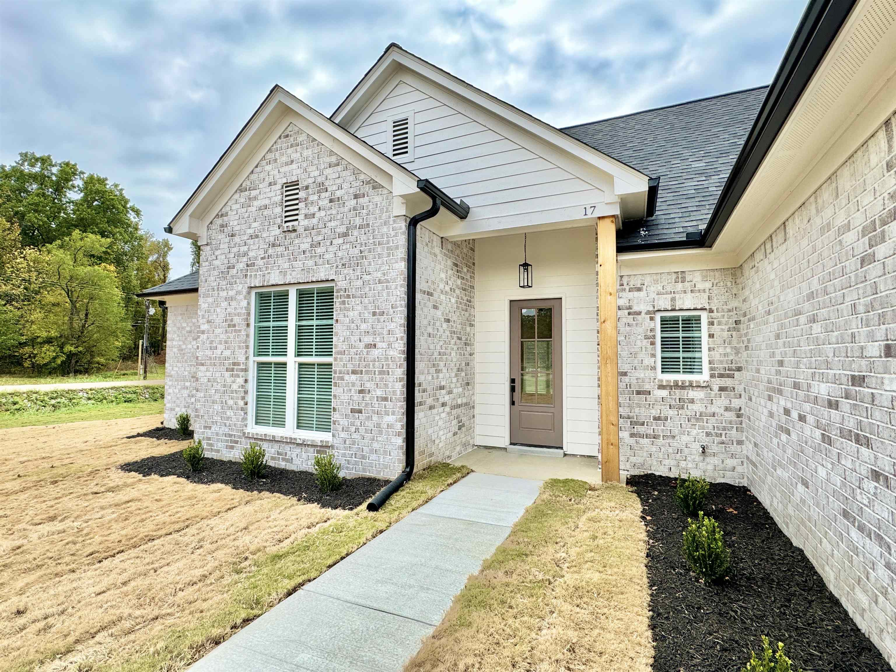 17 Edith Lane Atoka, TN 38004 - Photo 5 of 36 a front view of a house with a yard