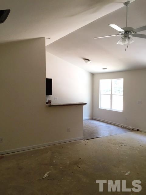 2925 Smooth Stone Trail Raleigh, NC 27610 - Photo 2 of 10 a view of a livingroom with a ceiling fan and window