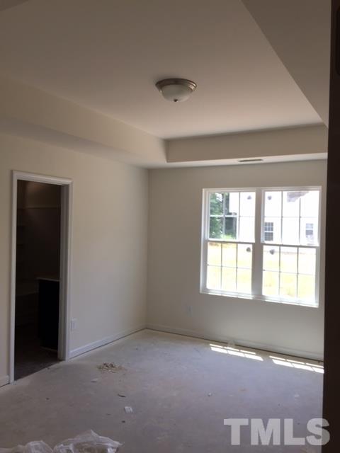 2925 Smooth Stone Trail Raleigh, NC 27610 - Photo 5 of 10 a view of an empty room with a window