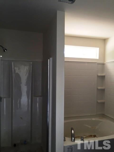 2925 Smooth Stone Trail Raleigh, NC 27610 - Photo 6 of 10 a bathroom with a bathtub