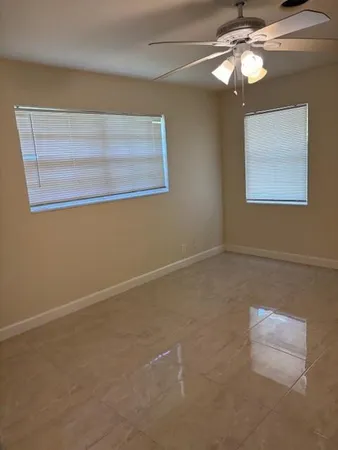 an empty room with a mirror