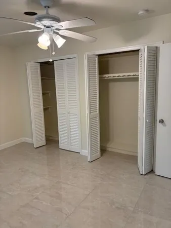 a room with sliding door and wooden floor