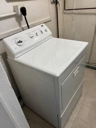 a bathroom with a sink shower and a mirror