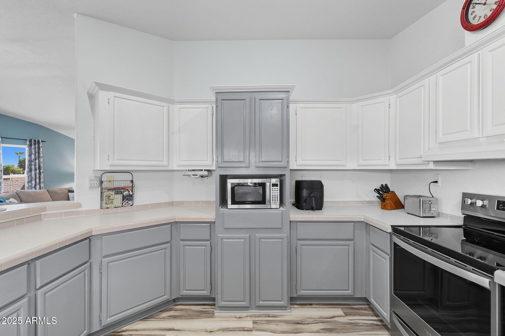3700 South Tomahawk Road, Unit 39 Apache Junction, AZ 85119 - Photo 25 of 53 a kitchen with stainless steel appliances granite countertop a refrigerator sink stove and white cabinets