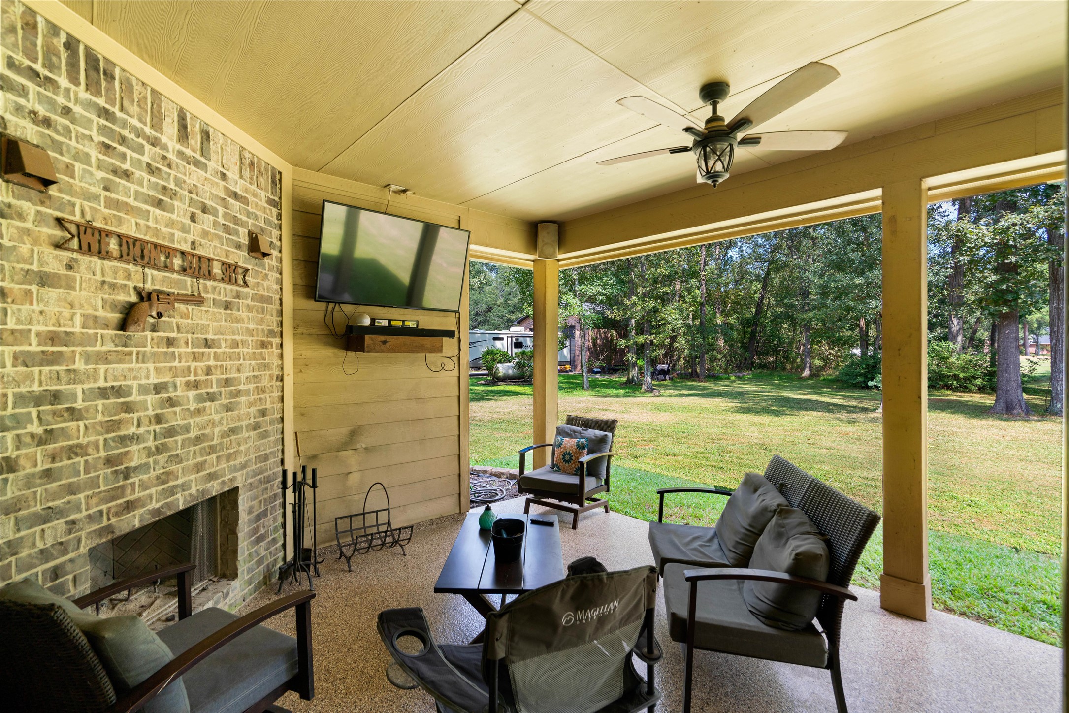 26806 Winding River Trail Huffman, TX 77336 - Photo 24 of 40 covered porch with fireplace for entertaining overlooking golf course
