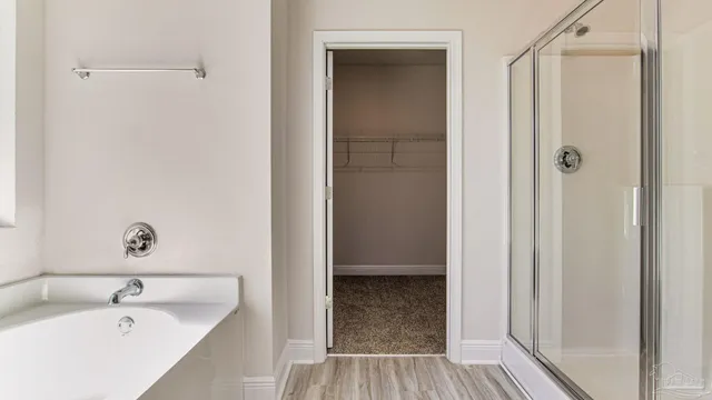 a bathroom with a tub and sink