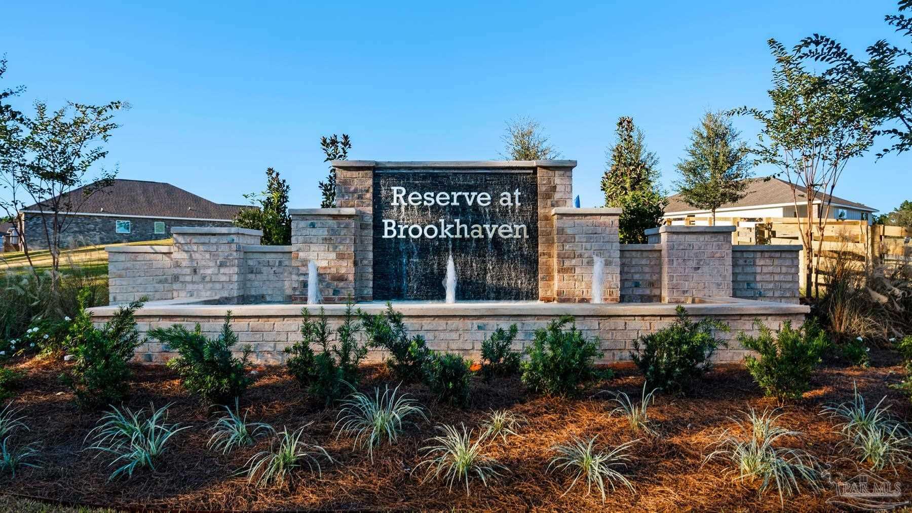 3472 Crossvine Road Cantonment, FL 32533 - Photo 2 of 23 a front view of a house with garden