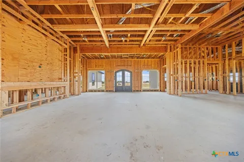 a view of a room with wooden walls