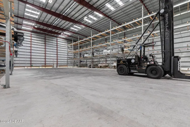 a view of parking garage with cars