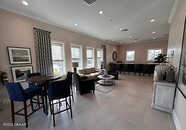 10 Rio Vista Drive Palm Coast, FL 32137 - Photo 32 of 39 a living room with furniture and a large window
