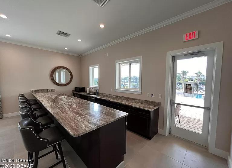 10 Rio Vista Drive Palm Coast, FL 32137 - Photo 34 of 39 a kitchen with granite countertop a sink and a stove