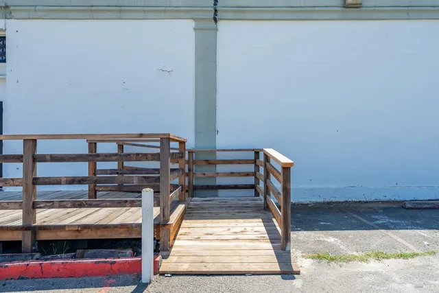 a view of people sitting in front of retail shop