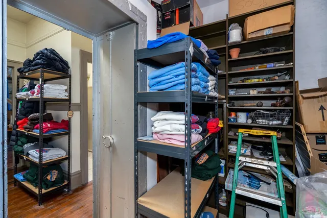 a room with furniture and a floor to ceiling window