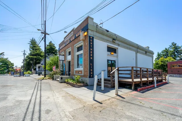 a view of a patio with wooden floor