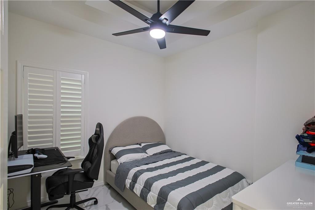 620 Oaxaca Street Alton, TX 78573 - Photo 12 of 23 a bedroom with a bed and a window