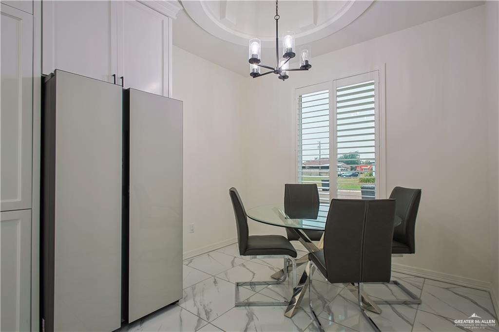 620 Oaxaca Street Alton, TX 78573 - Photo 6 of 23 a view of a dining room with furniture window and outside view