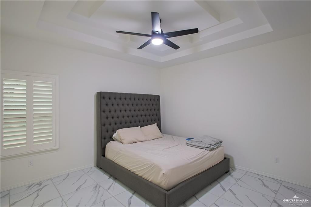 620 Oaxaca Street Alton, TX 78573 - Photo 7 of 23 a bedroom with a bed and window