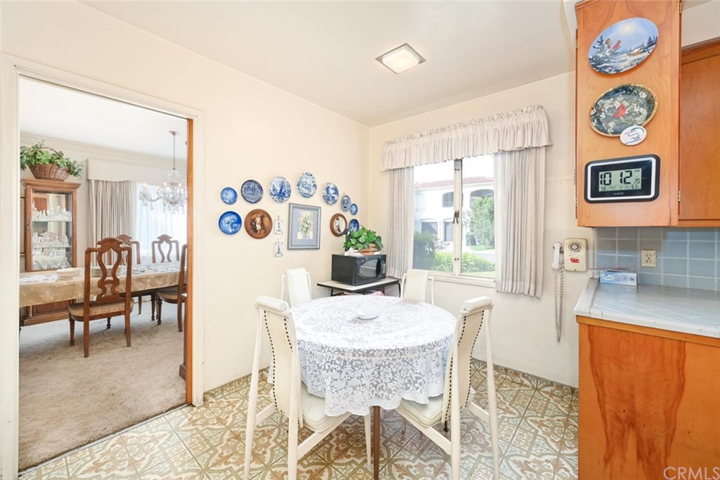 9505 Raviller Drive Downey, CA 90240 - Photo 17 of 54 a dining room with furniture and window