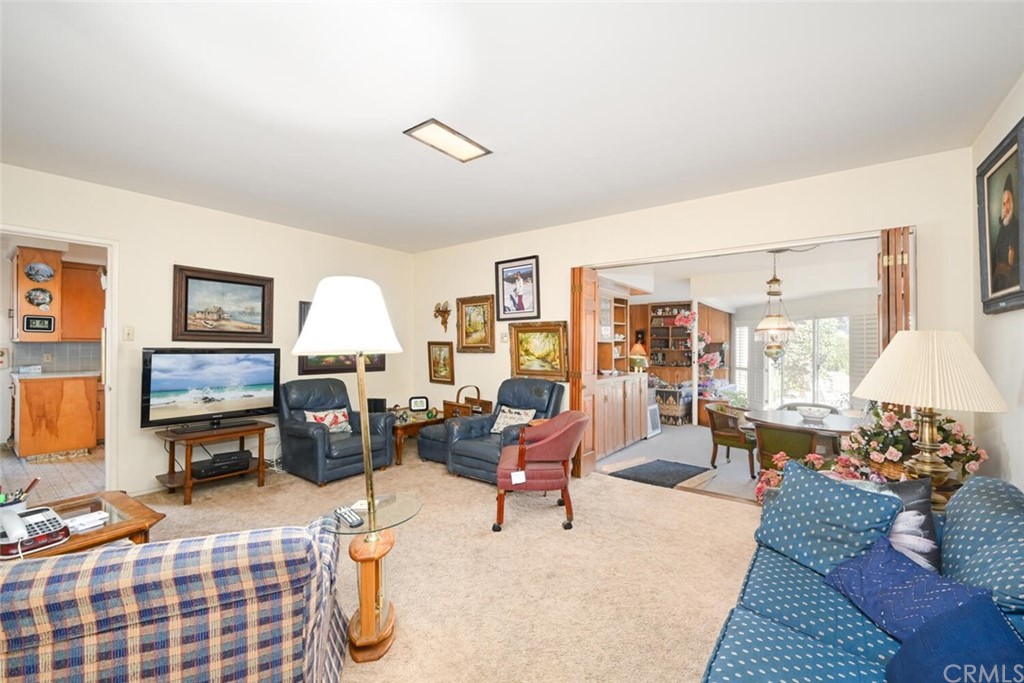 9505 Raviller Drive Downey, CA 90240 - Photo 27 of 54 a living room with furniture and a flat screen tv
