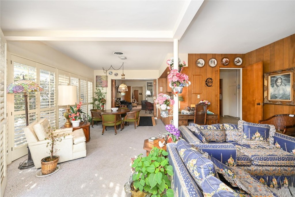 9505 Raviller Drive Downey, CA 90240 - Photo 37 of 54 a living room with patio furniture and a large window