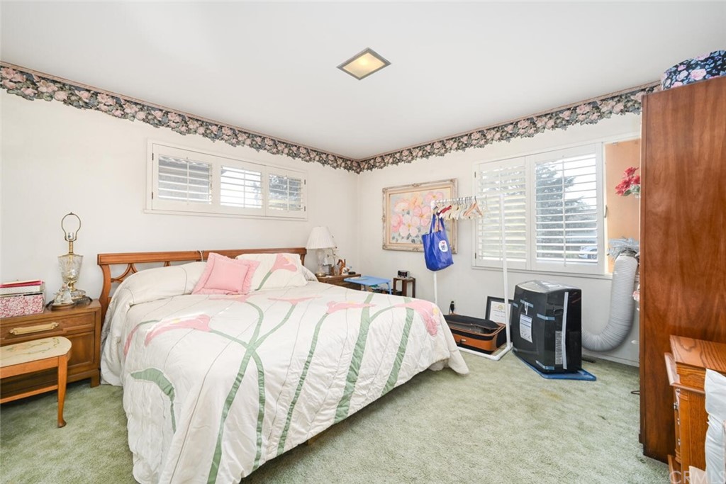 9505 Raviller Drive Downey, CA 90240 - Photo 42 of 54 a bedroom with a bed and a window