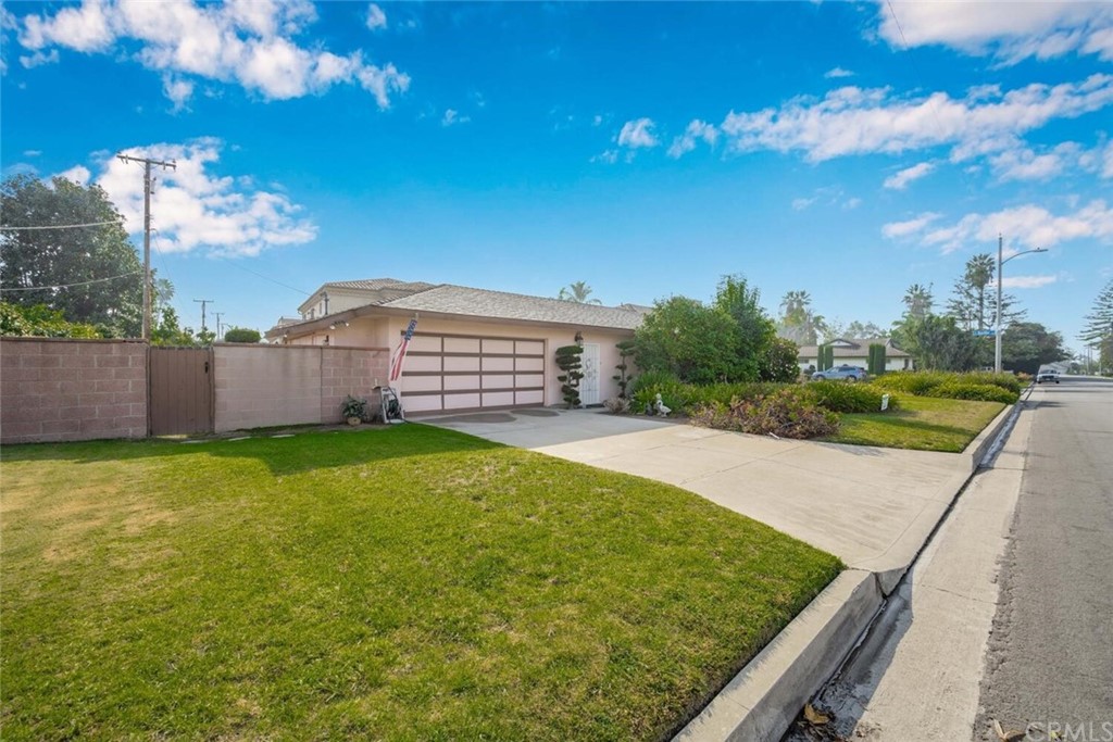9505 Raviller Drive Downey, CA 90240 - Photo 45 of 54 a view of a backyard with a garden and tree