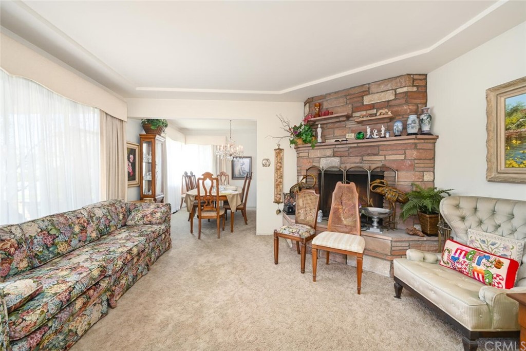 9505 Raviller Drive Downey, CA 90240 - Photo 9 of 54 a living room with furniture and a fireplace