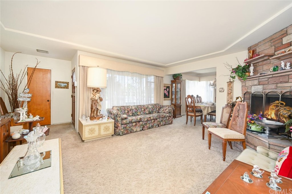 9505 Raviller Drive Downey, CA 90240 - Photo 10 of 54 a living room with furniture and a couch