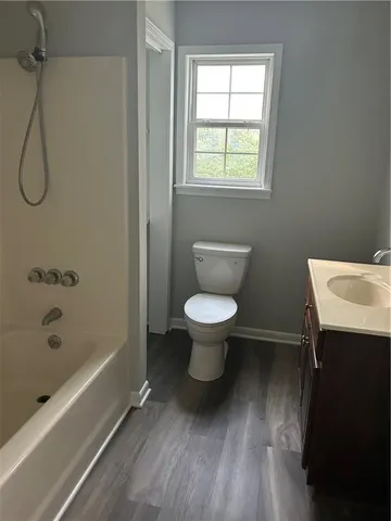 a bathroom with a toilet and a sink