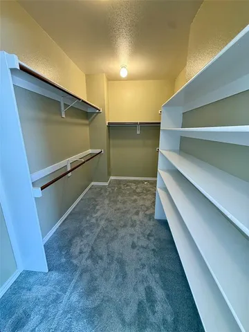 a bathroom with a sink mirror vanity and toilet