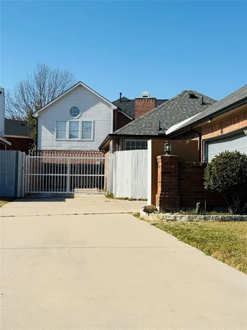 a view of a big room with wooden floor and windows